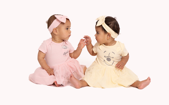 Two Infants wearing Disney Baby Dress and Headband Sets