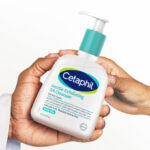 Two Persons Holding a Cetaphil Gentle Exfoliating SA Cleanser