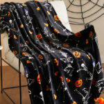 Way To Celebrate Halloween Skeletons Plush Throw on a Chair