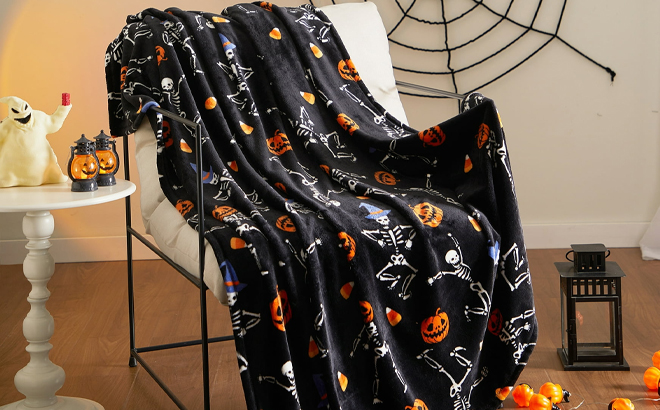 Way To Celebrate Halloween Skeletons Plush Throw on a Chair