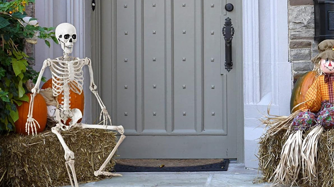 36 Inch Halloween Skeleton Decoration posing on the front door