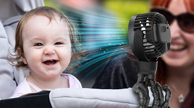 A Baby with a Portable Stroller Fan