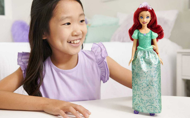 A Child Playing with Disney Princess Ariel Doll