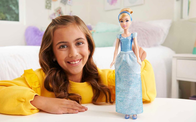 A Child Playing with Disney Princess Cinderella Doll