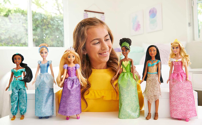 A Child Playing with Disney Princess Dolls