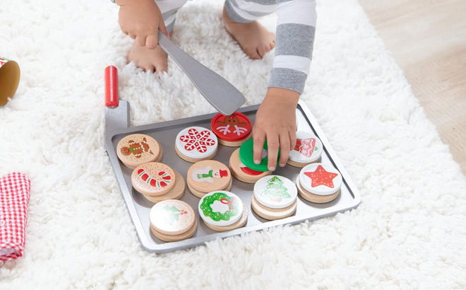 A Child Playing with Melissa Doug Christmas Cookie Play Food Set