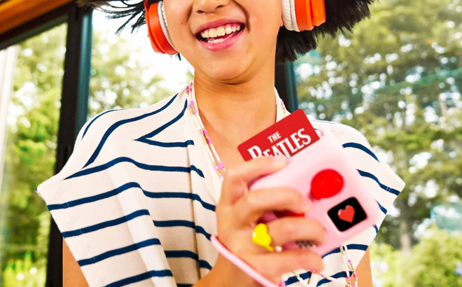 A Girl Listening to Yoto Player