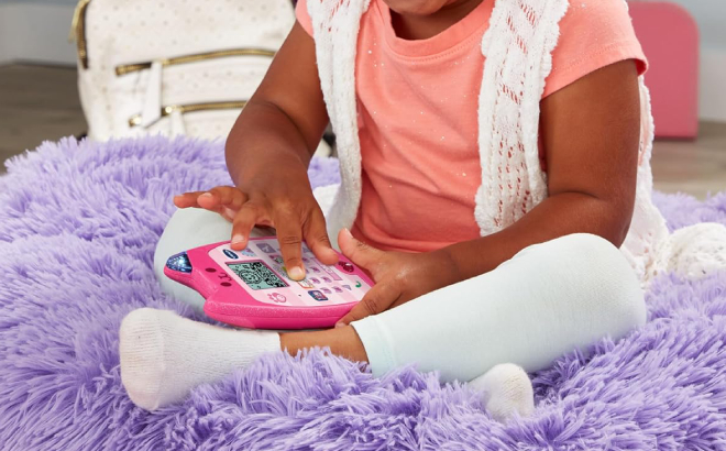 A Girl Playing with VTech Gabbys Dollhouse A Meow Zing Phone