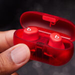 A Hand holding Beats Solo Buds True Wireless Bluetooth Earbuds