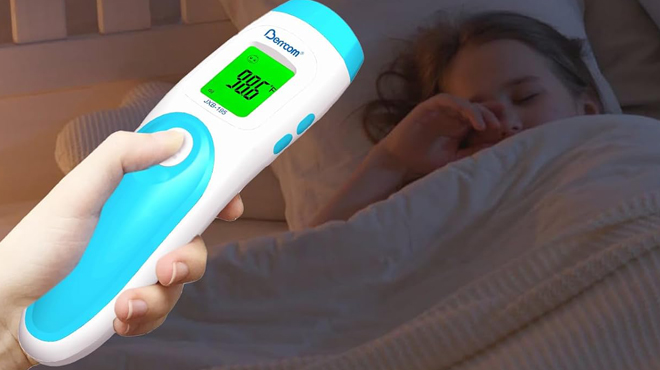 A Hand holding a Berrcom Non Contact Forehead Thermometer