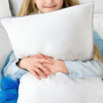 A Kid Holding Viewstar Bed Pillow