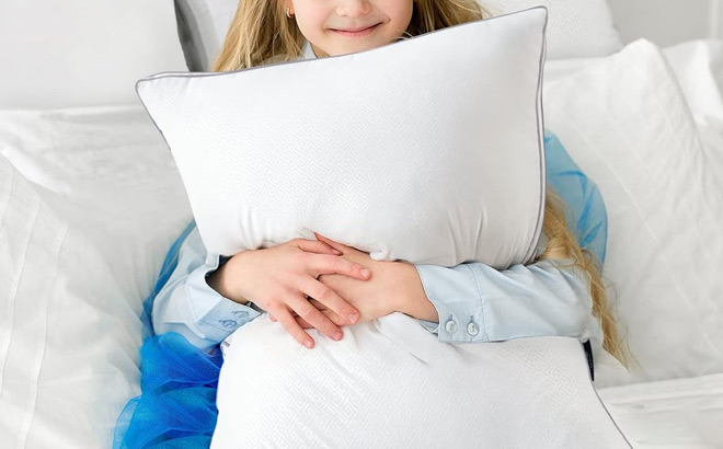 A Kid Holding Viewstar Bed Pillow