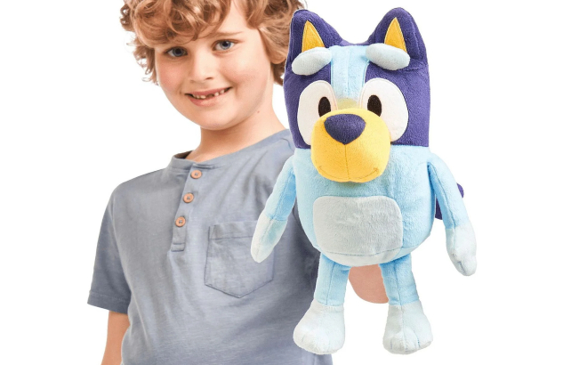 A Kid Holding a Bluey Talking Plush