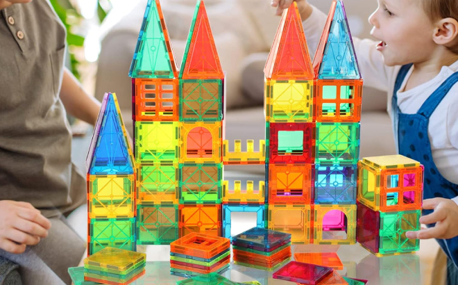 A Kid Playing with Magnetic Tiles Building Set