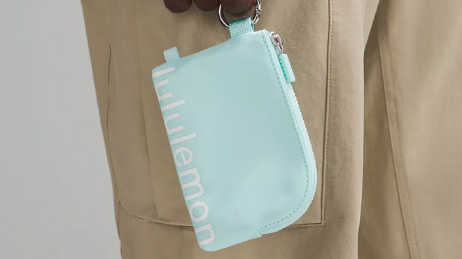 A Man Holding Lululemon Clippable Card Pouch