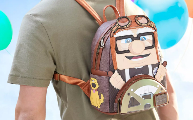 A Man Wearing Carl Fredricksen Loungefly Mini Backpack