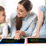 A Mother and kids Using Kids LCD Writing Tablets