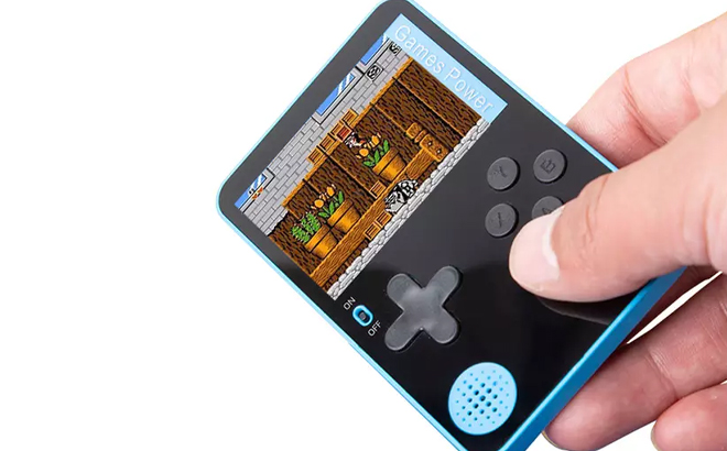 A Person Holding 2 4 Inch Handheld Retro Video Game Console Built in 500 Classic Games Console