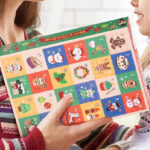 A Person Holding Advent Calendar with Straw Toppers