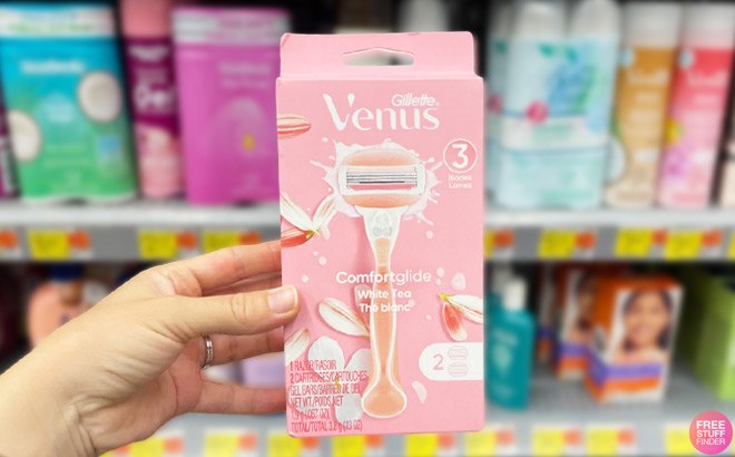 A Person Holding Gillette Venus Comfort Glide White Tea Razors