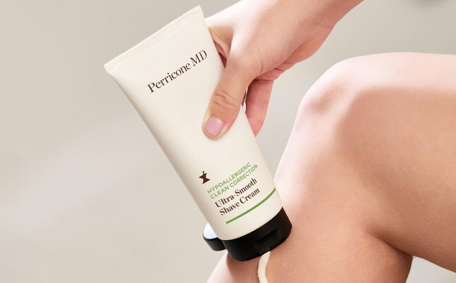 A Person Holding Perricone Hypoallergenic Clean Correction Ultra Smooth Shave Cream