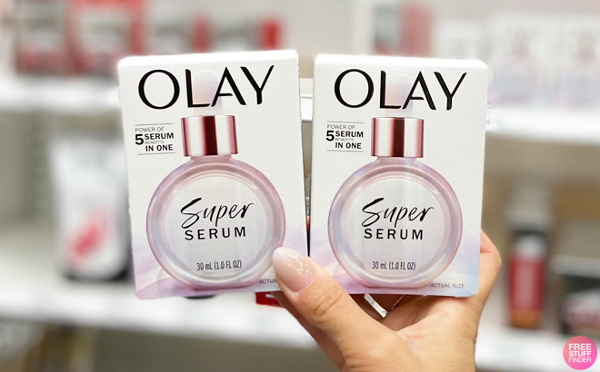 A Person Holding Two Olay Super Serums