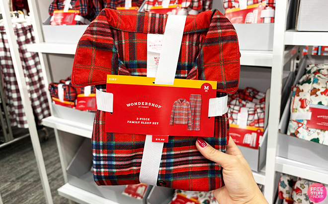 A Person Holding Wondershop Red Plaid Holiday Matching Family Pajamas