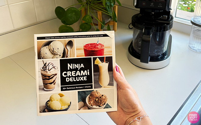 A Person Holding a Frozen Treat Recipe Book