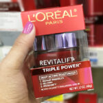 A Person Holding a LOreal Triple Power Anti Aging Moisturizer