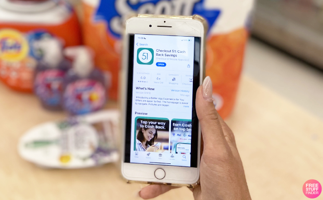 A Person Holding a Phone with Checkout 51 App Flashed on Screen