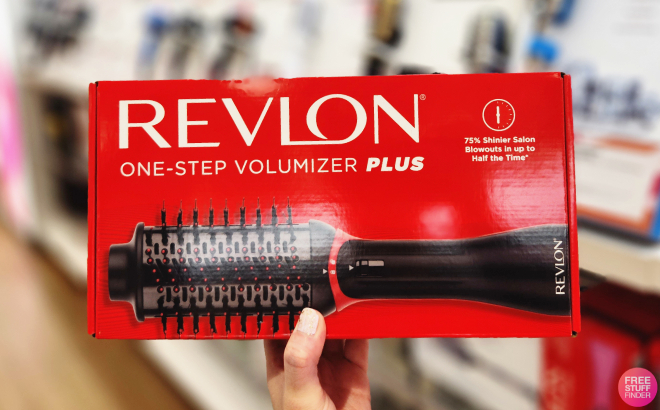 A Person Holding a Revlon One Step Volumizer Plus