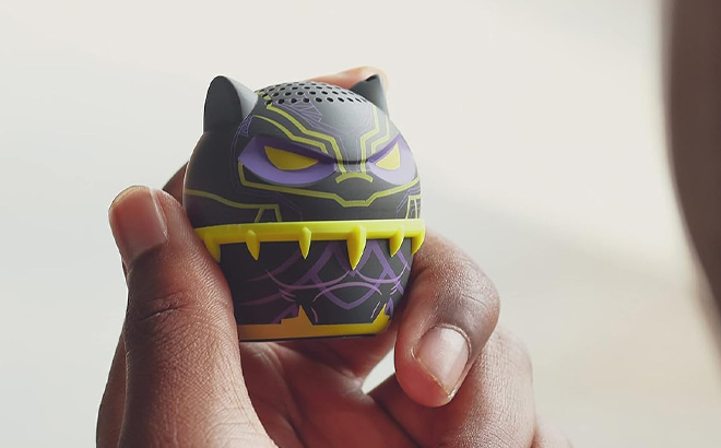 A Person Holding the Bitty Boomers Marvel Black Panther Blacklight Mini Bluetooth Speaker