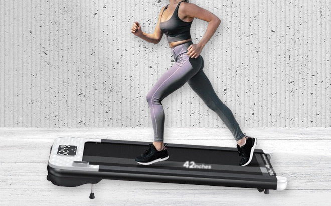 A Person Running on the Wellfit Walking Pad Treadmill