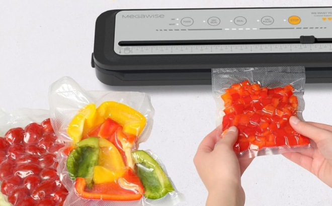 A Person Sealing Vegetables Using a Megawise Food Vacuum Sealer