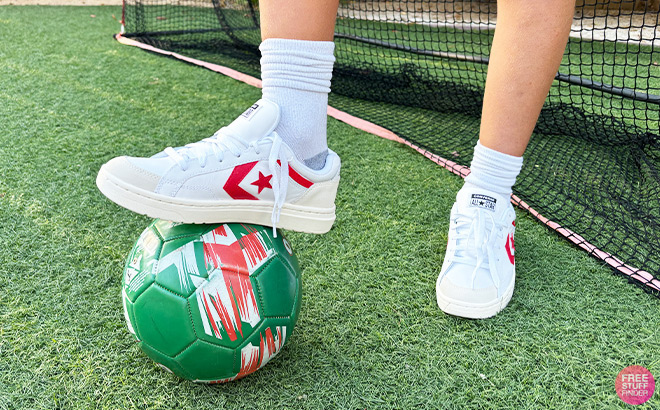 A Person Standing on a Ball with Shoe