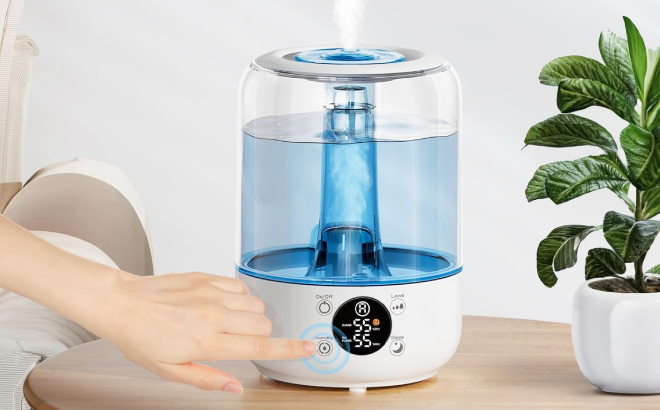 A Person Turning on a Cool Mist Humidifier