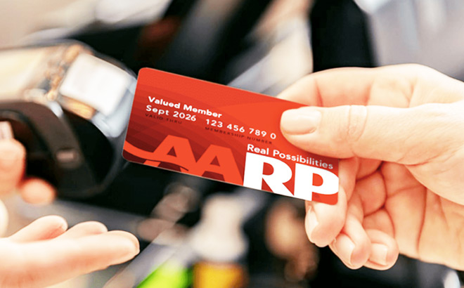 A Person Using Aarp Membership Card for Savings