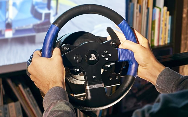 A Person Using Thrustmaster Racing Wheel for Gaming