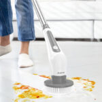 A Person Using an Electric Spin Scrubber to clean the floor 1