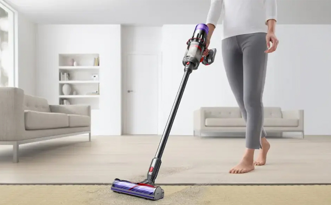 A Person Using the Dyson Digital Slim Cordless Vacuum