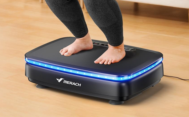 A Person Using the Merach VIbration Exercise Plate on the Floor