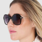 A Person Wearing Guess Womens Black Sunglasses