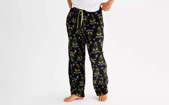 A Person Wearing Licensed Character Mens Dr Seuss How the Grinch Stole Christmas Super Minky Pajama Pants