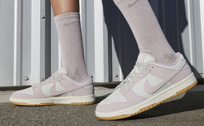 A Person Wearing Nike Dunk Low Premium Next Nature Womens Shoes