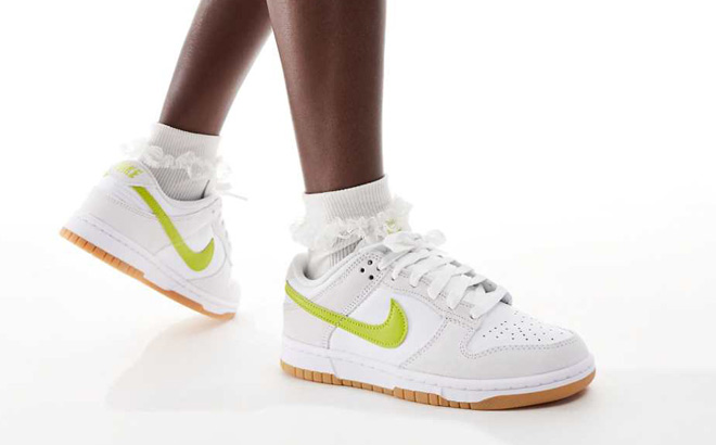 A Person Wearing Nike Dunk Low Shoes in White Gum Yellow Bright Cactus Color