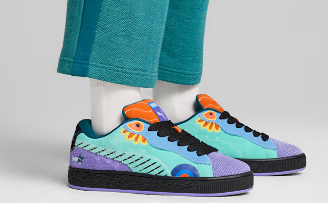 A Person Wearing PUMA Suede XL Dia De Los Muertos Shoes