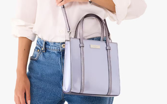 A Person Wearing the Kate Spade Kenzie Small Tote in Light Blue