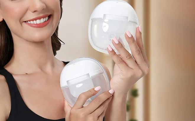 A Person holding MomMed Double Breast Pump