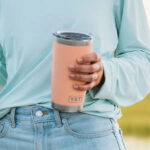 A Person holding a Yeti 20 Ounce Rambler Tumbler