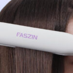 A Person using Faszin 2 in 1 Hair Straightener and Curler on their Hair